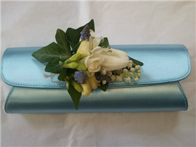All cream tulip, freesia and muscari bag corsage